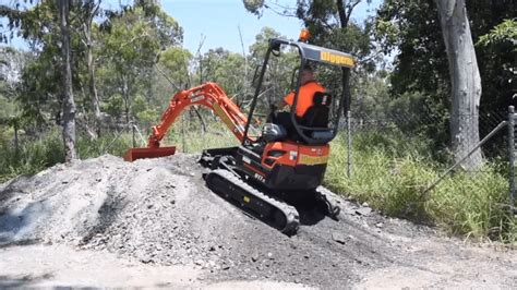 mini digger up steps|climbing a slope with mini excavator.